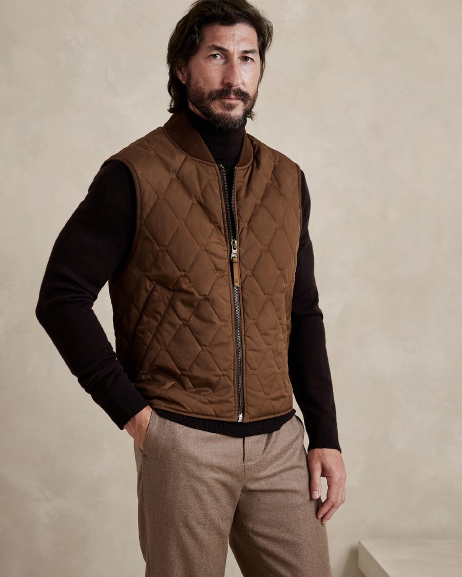 Men's brown pants, black turtleneck and brown suede padded vest outfit
