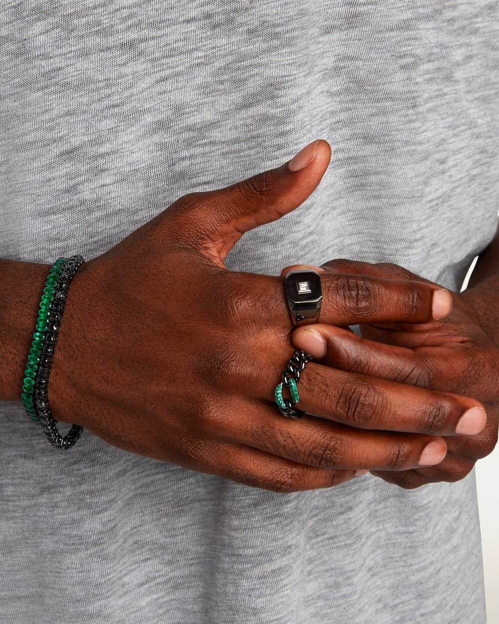 Black man wearing Shay luxury bracelets and rings