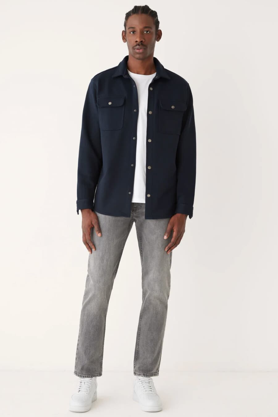 Men's grey jeans, white T-shirt, navy overshirt and white sneakers outfit
