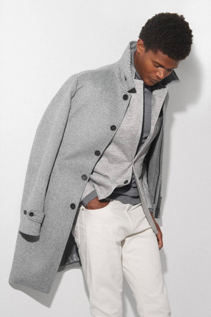 Men's white chinos, grey long sleeve top, grey blazer and grey overcoat outfit