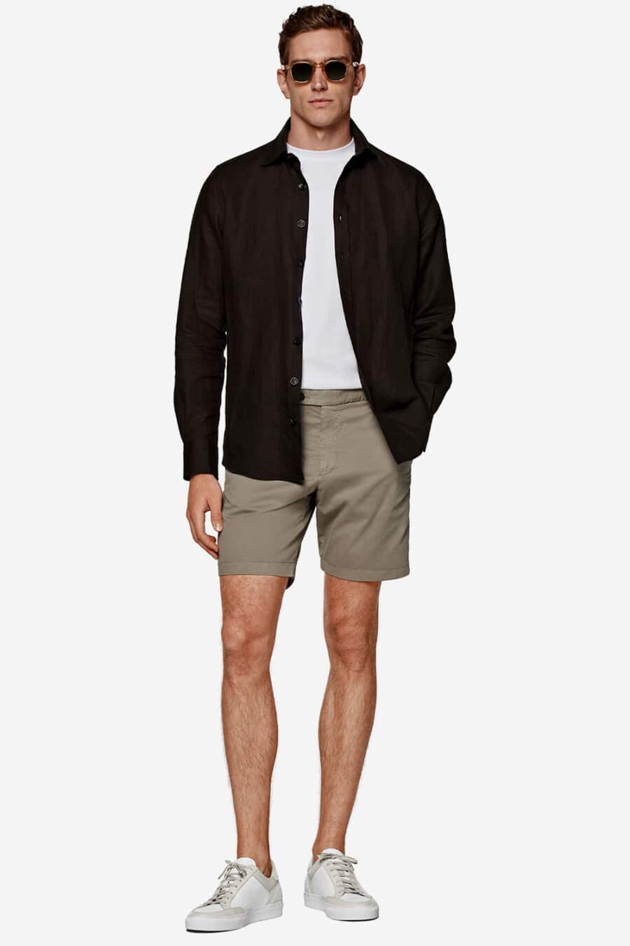Men's pale green shorts, white T-shirt, open black shirt and white sneakers outfit