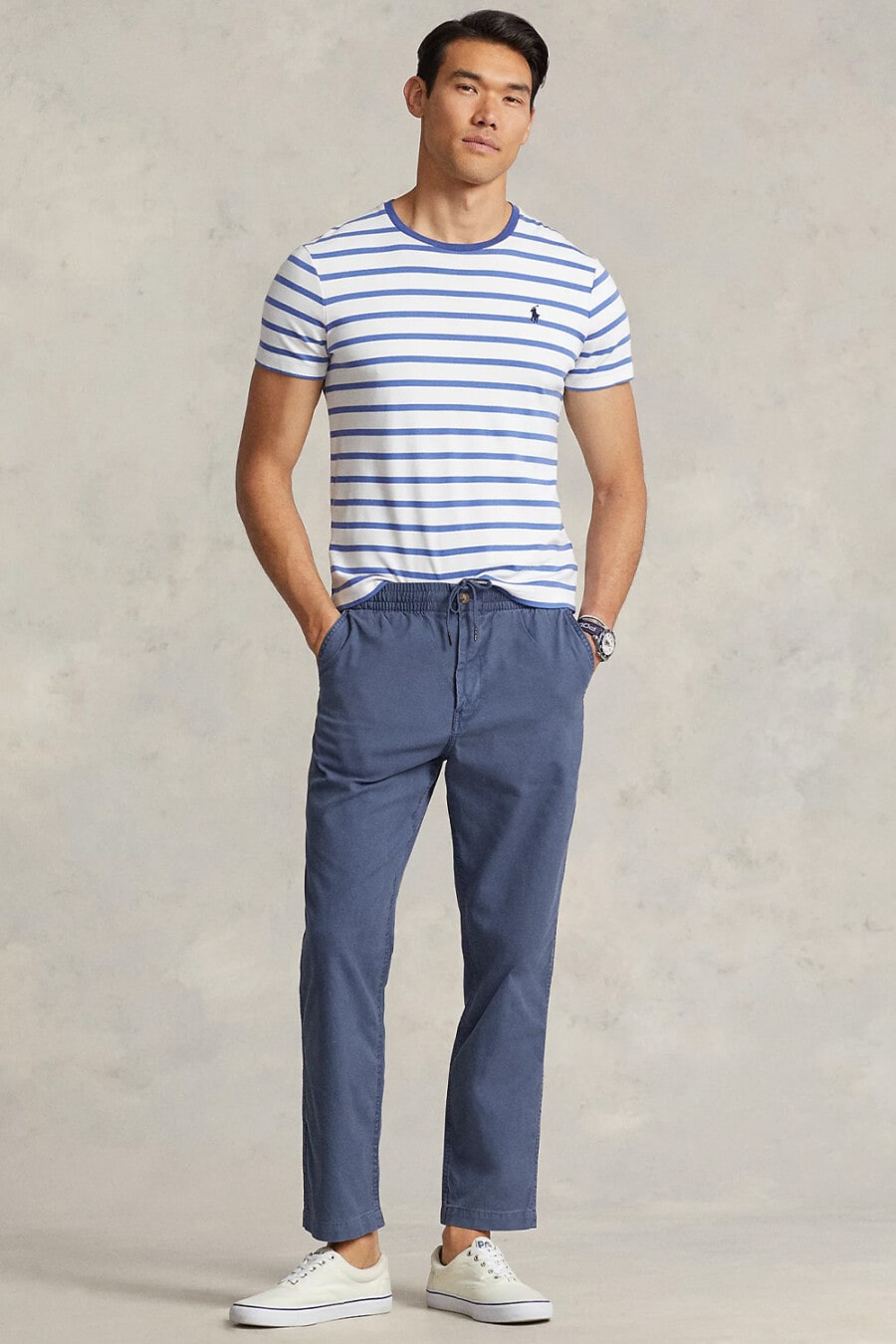 Men's mid blue pants, white/blue Breton t-shirt and off-white canvas skate shoes outfit by Ralph Lauren