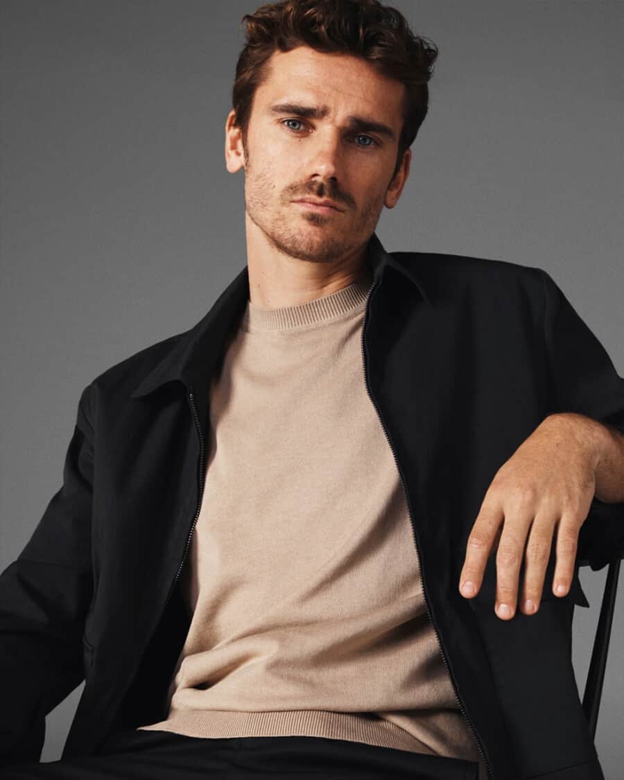 Men's T-shirt trend - Antione Griezmann wearing a knitted tee with a black jacket
